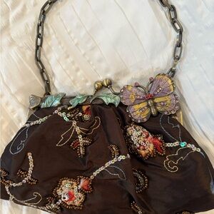 Brown and Purple Clutch with Floral Embellishments